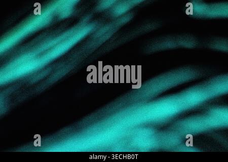 Abstract diagonal streaks of vibrant cyan and teal light with grainy noise effect Stock Photo