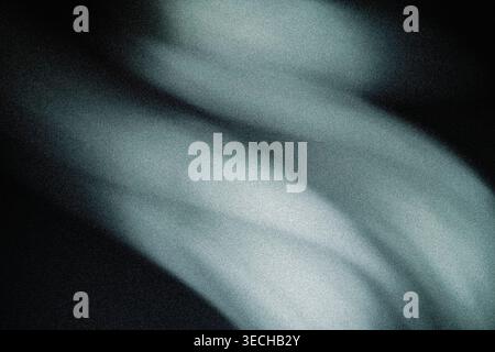 Blurred abstract motion background with soft grey and teal light streaks and noise texture Stock Photo