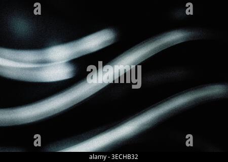 Futuristic blurred light trails on dark background with grainy noise effect Stock Photo