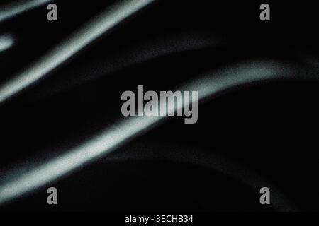 Dark minimalist abstract background with soft grainy light rays and shadows Stock Photo