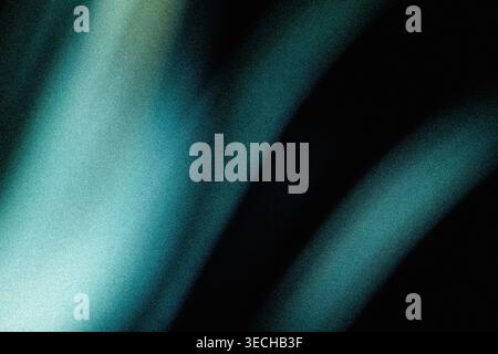 Teal and blue diagonal grainy light beams on dark Stock Photo