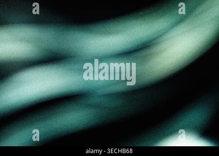 Ethereal glowing wavy bands of teal light blending into dark grainy textured space Stock Photo