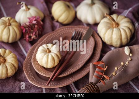 Rustic Thanksgiving tablescape with pumpkins and autumn tones Stock Photo