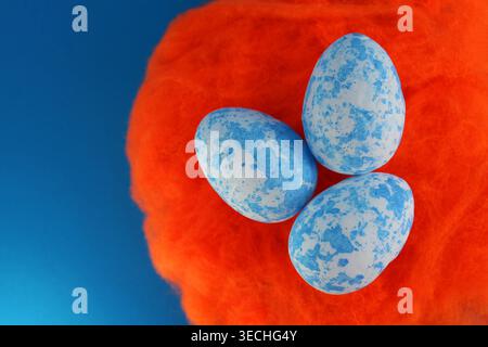 Three spotted eggs on a nest Stock Photo