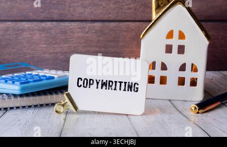 Creative Data word hologram and hand writing in notebook on background with laptop, big data and blockchain concept. Multiexposure Stock Photo