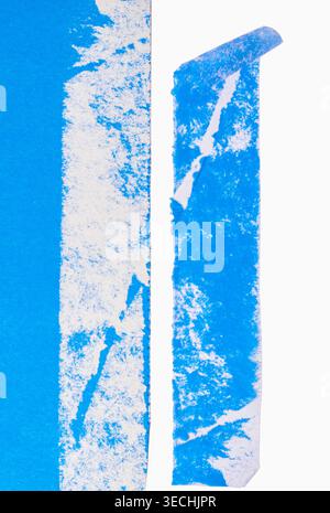 Blue adhesive tape strips peeling off on a white background, revealing a rough, abstract textured surface Stock Photo