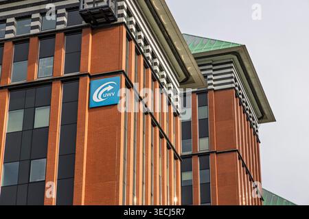 Amsterdam, Netherlands, April 24, 2026. Detailed shot of the blue UWV logo and signage on a contemporary brick office building under a soft daylight. Stock Photo