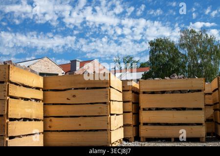 Large wooden crates containing stone paving blocks Stock Photo