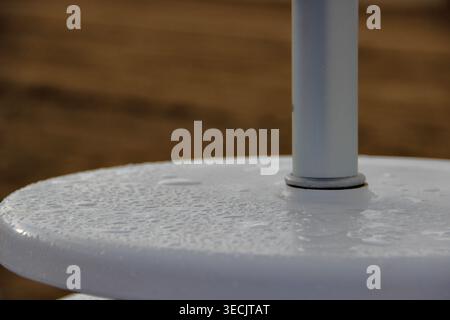 Raindrops on Outdoor Table at the Beach Stock Photo