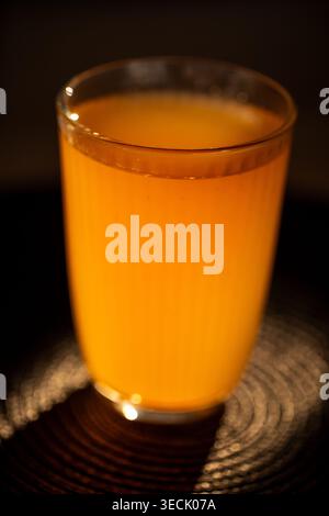 Fruit compote in glass on dark black background Stock Photo