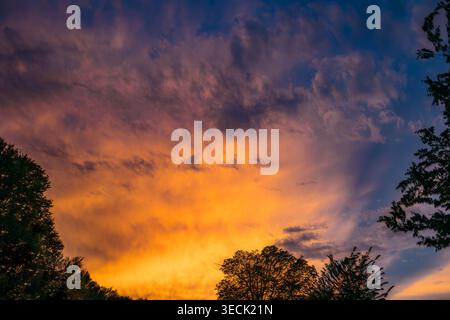 Dramatic Colorful Sunset Sky with Sunrays Stock Photo