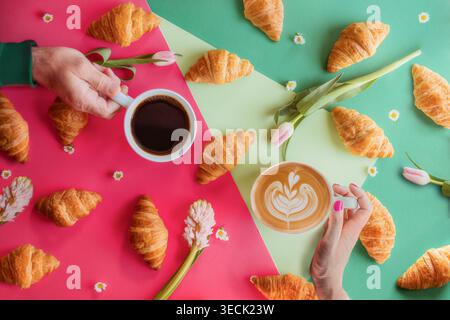 Brightly Colored Flay-lay of Coffee and Crescent Rolls Stock Photo