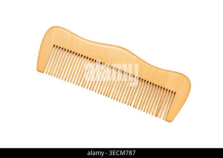 Close‑up of a wooden comb with fine teeth and curved ergonomic shape, isolated on a white background, showing natural texture and craftsmanship Stock Photo