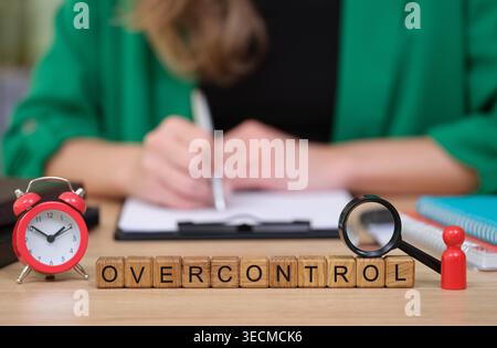 In a cozy workspace, a person focuses on notes while surrounded by tools of organization. A clock ticks nearby, highlighting the importance of time ma Stock Photo