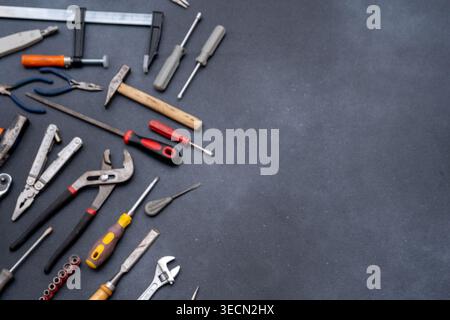 Different Hand Tools on Dark Background copy space. Stock Photo