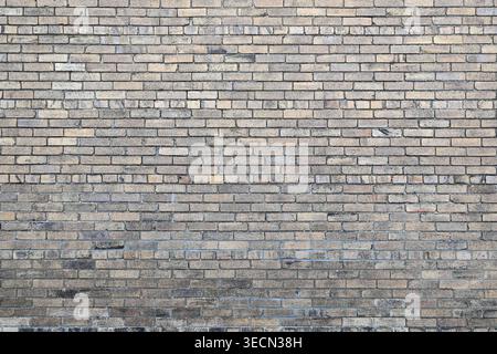 old yellow bricks weathered with texture background Stock Photo