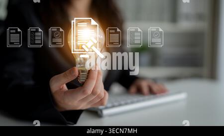 A business professional holds a light bulb while surrounded by digital document icons, illustrating the blend of creativity and data management in Stock Photo