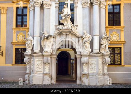 A close-up view of the magnificent Baroque entrance portal of Durnstein Abbey (Stift Durnstein) in Lower Austria. The image highlights the elaborate w Stock Photo