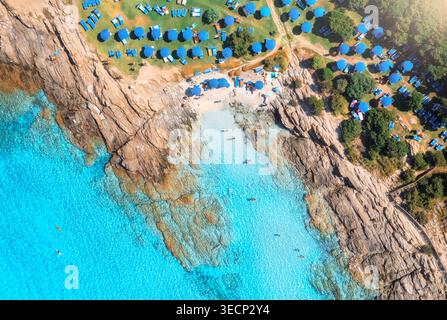 Aerial drone view of sea bay, sandy beach with umbrellas Stock Photo