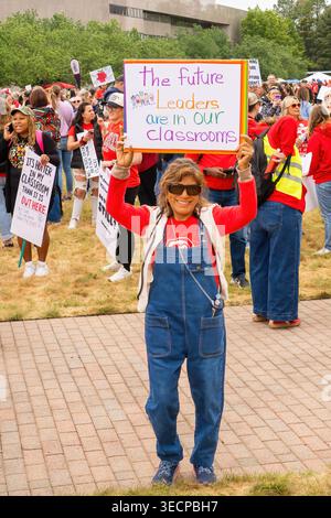 A demonstrator holds a sign reading “On saigne tous de la même couleur ...