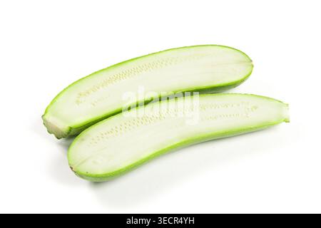 Two halves of a fresh green zucchini on a white background Stock Photo