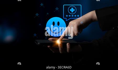 A close-up of a hand interacting with a smartphone screen featuring a smiley face and rating symbols, representing user engagement and feedback in the Stock Photo