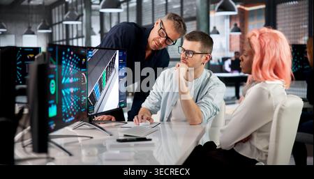 Data Scientist Leads Diverse Team Monitoring AI Cluster Using Immersive 3D Tools. Stock Photo