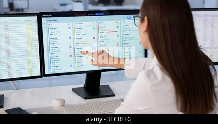 Healthcare Manager Uses Digital Platform To Schedule Patient Appointments Efficiently. Stock Photo