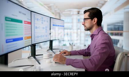 Experienced Business Analyst Reviews Strategic Flow Diagram On Computer Screen. Stock Photo