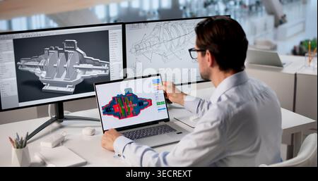 Experienced Engineer Uses Laptop Software To Design Efficient Turbine Model. Stock Photo