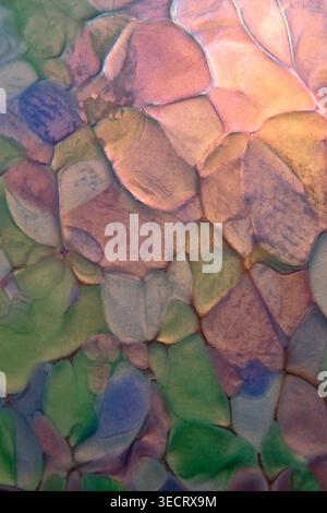 Film photo of an abstract composition of smooth stones under water, showing soft shapes, blended colors and organic patterns, creating a natural textu Stock Photo