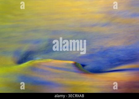Film photo of abstract patterns in the Swift River in Vermont, created by long exposure, showing flowing water with autumn colors and reflections of s Stock Photo