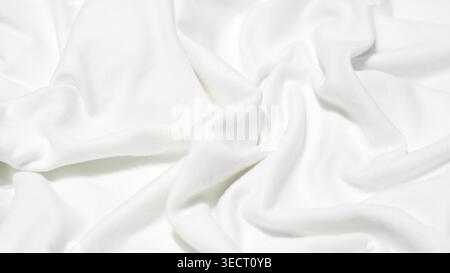 detailed view of white fabric with deep, irregular folds and a soft, matte texture Stock Photo