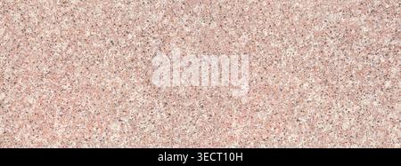 Pink granite surface showing a detailed, polished stone texture Stock Photo