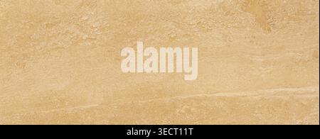 Light beige travertine stone showing natural texture and horizontal patterns for backgrounds Stock Photo