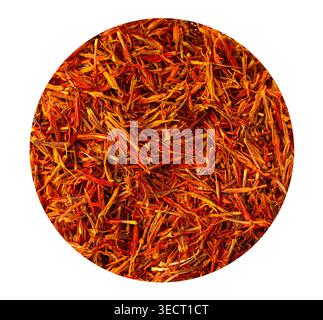 Dried saffron threads filling a circle, showing vibrant red and orange colors Stock Photo
