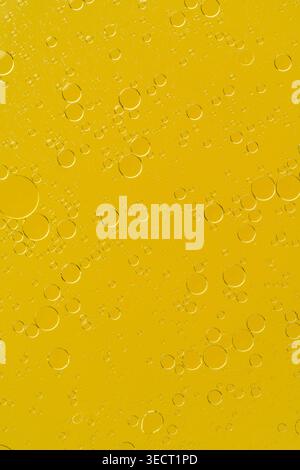 Golden liquid with bubbles abstract macro background Stock Photo