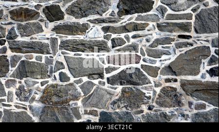 Exterior stone brick wall angled shape medieval Stock Photo