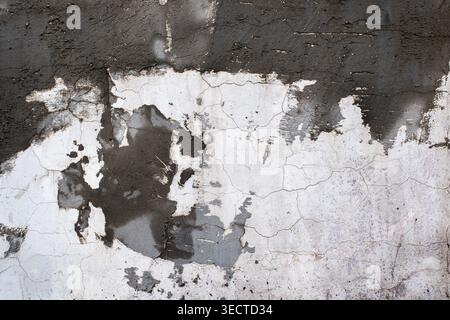 Grunge style cracked weathered cement surface Stock Photo