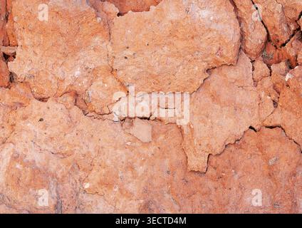 Demaged bricks and stone red orange surface grunge background Stock Photo