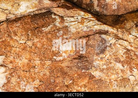 Brown golden  stone rock rough texture macro Stock Photo