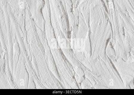 Concrete weathered surface vertical waves texture white macro Stock Photo
