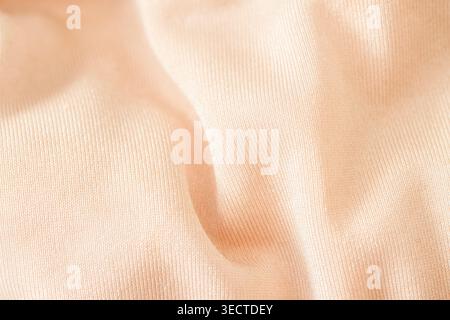 Light peach silky fabric texture Stock Photo