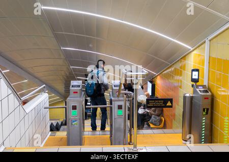 A solitary male passenger stands on the steeply angled floor inside a carriage of the unique Carmelit underground funicular system in Haifa Israel. Th Stock Photo