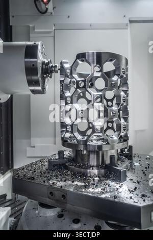 CNC milling machine processing an aluminum aerospace part.Precision CNC milling of an aluminum metal component in industrial machining center with vis Stock Photo