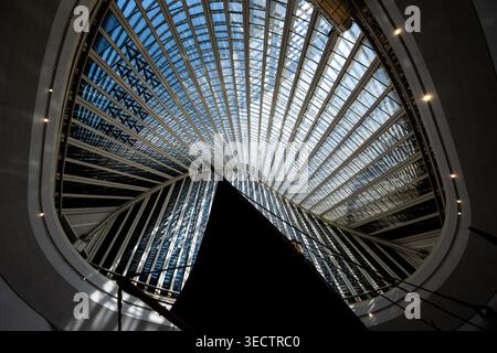 Modern architectural interior with radial glass ceiling structure and geometric symmetry Stock Photo