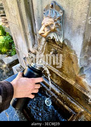 The gushing Buxton water fountain in the Crescent of the spa town in Derbyshire. Stock Photo