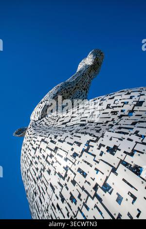 The Kelpies in Falkirk, Scotland, under sunny blue skies. The iconic horse head sculptures are a major Scottish landmark by artist Andy Scott Stock Photo