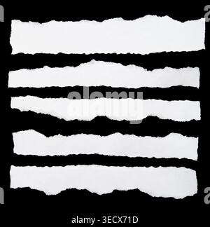 Ripped paper strips on black background Stock Photo