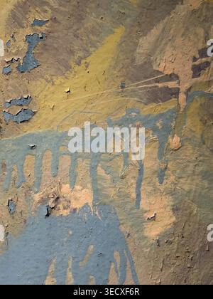 Many layers of peeling paint on an old wall before a new renovation Stock Photo